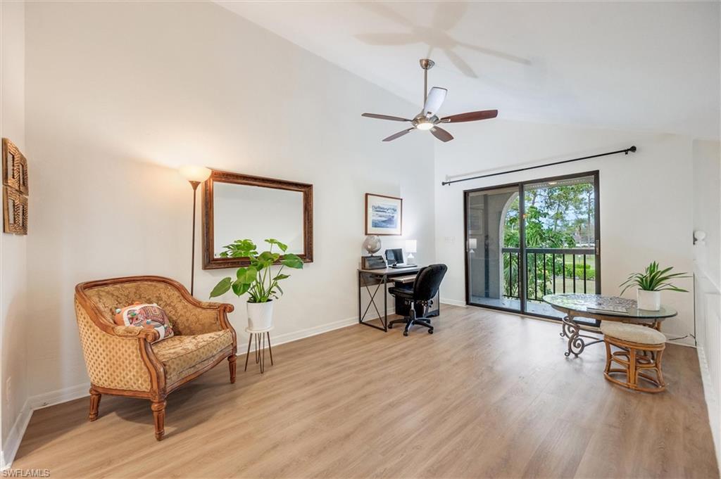 940 Augusta Boulevard, Unit D939 Naples, FL 34113 - Photo 18 of 42 a living room with furniture and a window