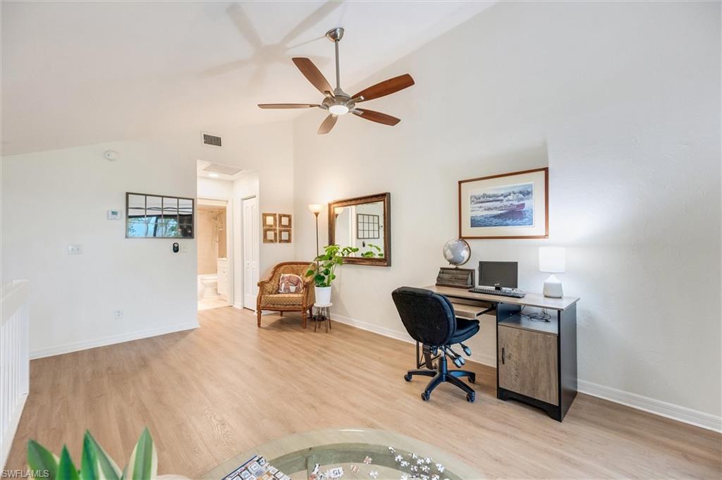 940 Augusta Boulevard, Unit D939 Naples, FL 34113 - Photo 20 of 42 a view of a workspace with furniture and a window