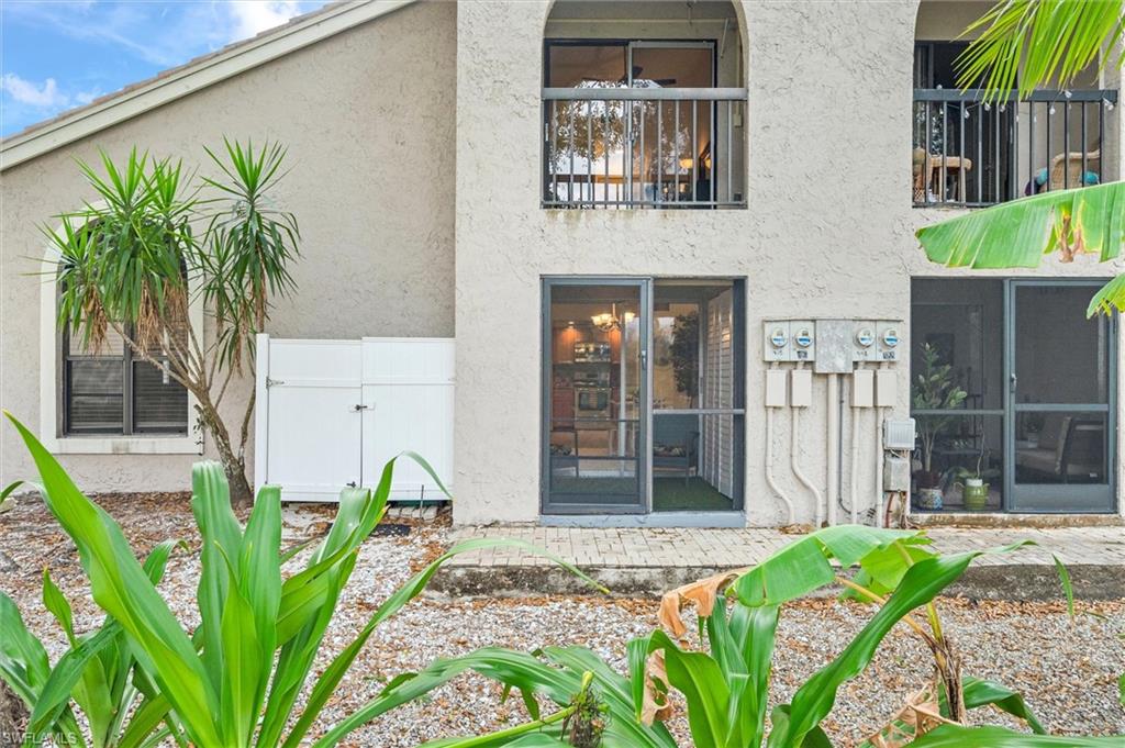940 Augusta Boulevard, Unit D939 Naples, FL 34113 - Photo 33 of 42 a front view of a house with garden