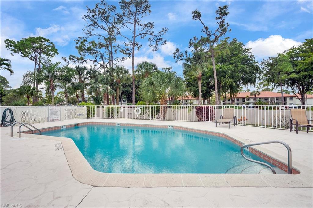 940 Augusta Boulevard, Unit D939 Naples, FL 34113 - Photo 34 of 42 a view of a swimming pool with a patio