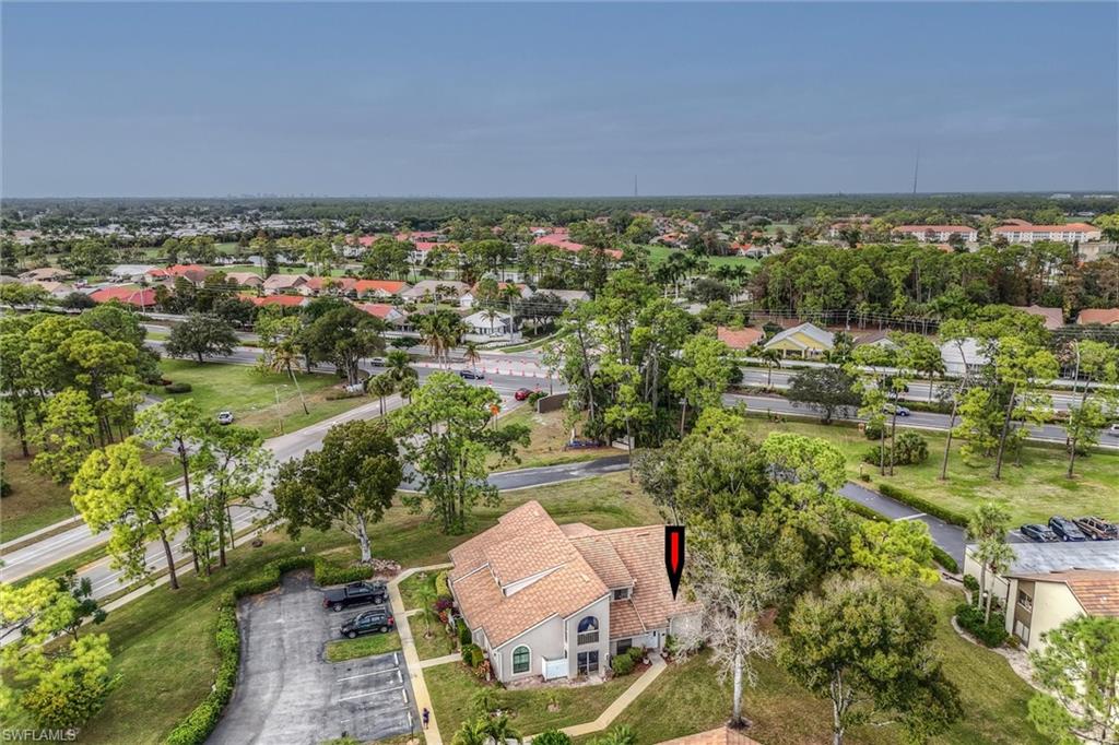 940 Augusta Boulevard, Unit D939 Naples, FL 34113 - Photo 36 of 42 an aerial view of residential house and outdoor space