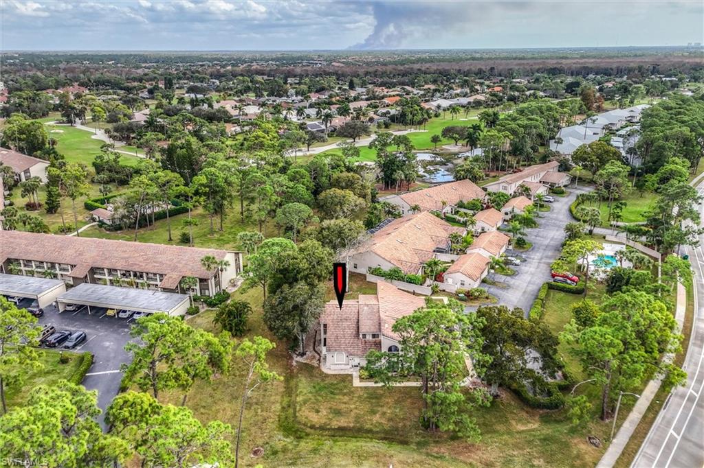 940 Augusta Boulevard, Unit D939 Naples, FL 34113 - Photo 39 of 42 an aerial view of a house with a yard