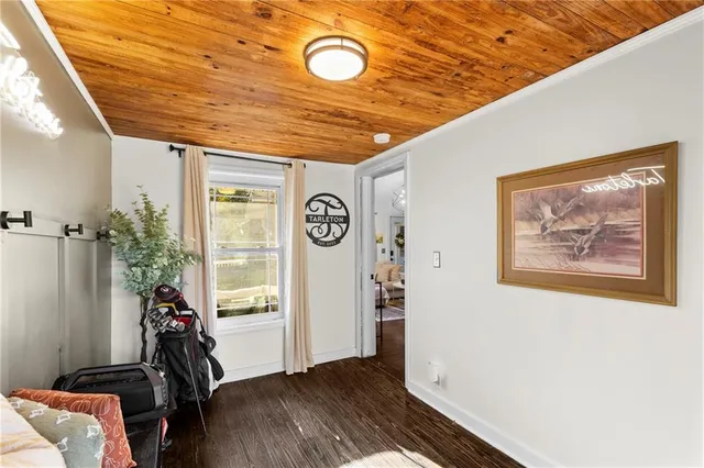 a balcony with table and chairs