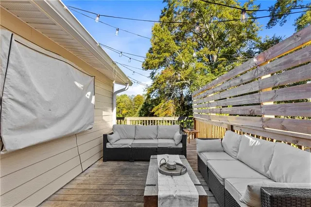 a kitchen with stainless steel appliances granite countertop a sink and wooden floors