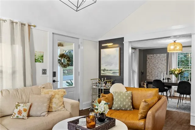 a view of a livingroom with furniture and a window