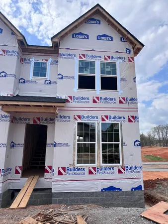 a front view of a house with an empty space