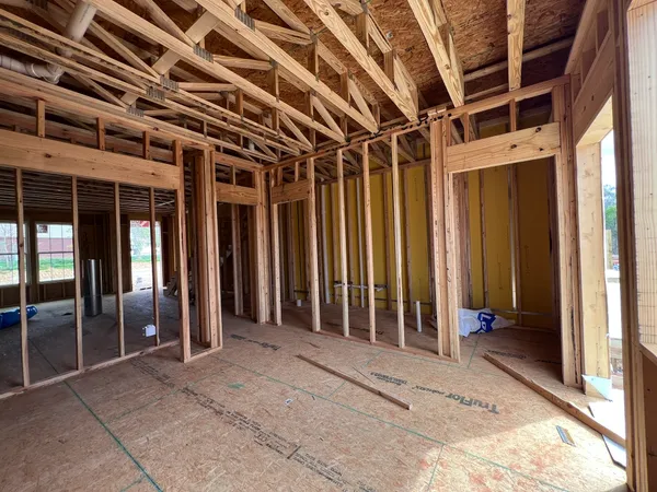 a view of a room with a wooden door
