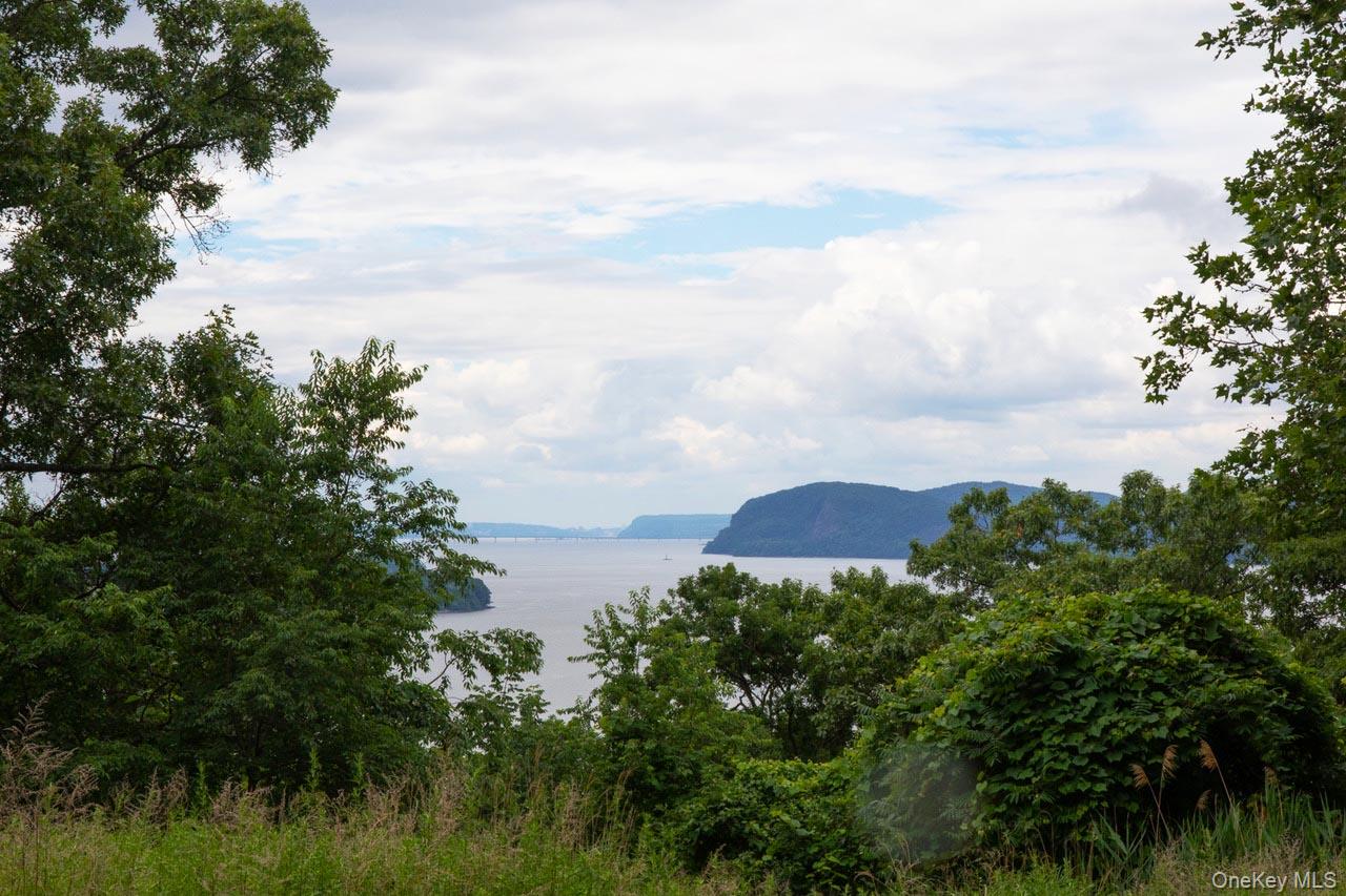 3 Prickly Pear Hill Road Croton-on-Hudson, NY 10520 - Photo 14 of 16 a view of a lake and a yard