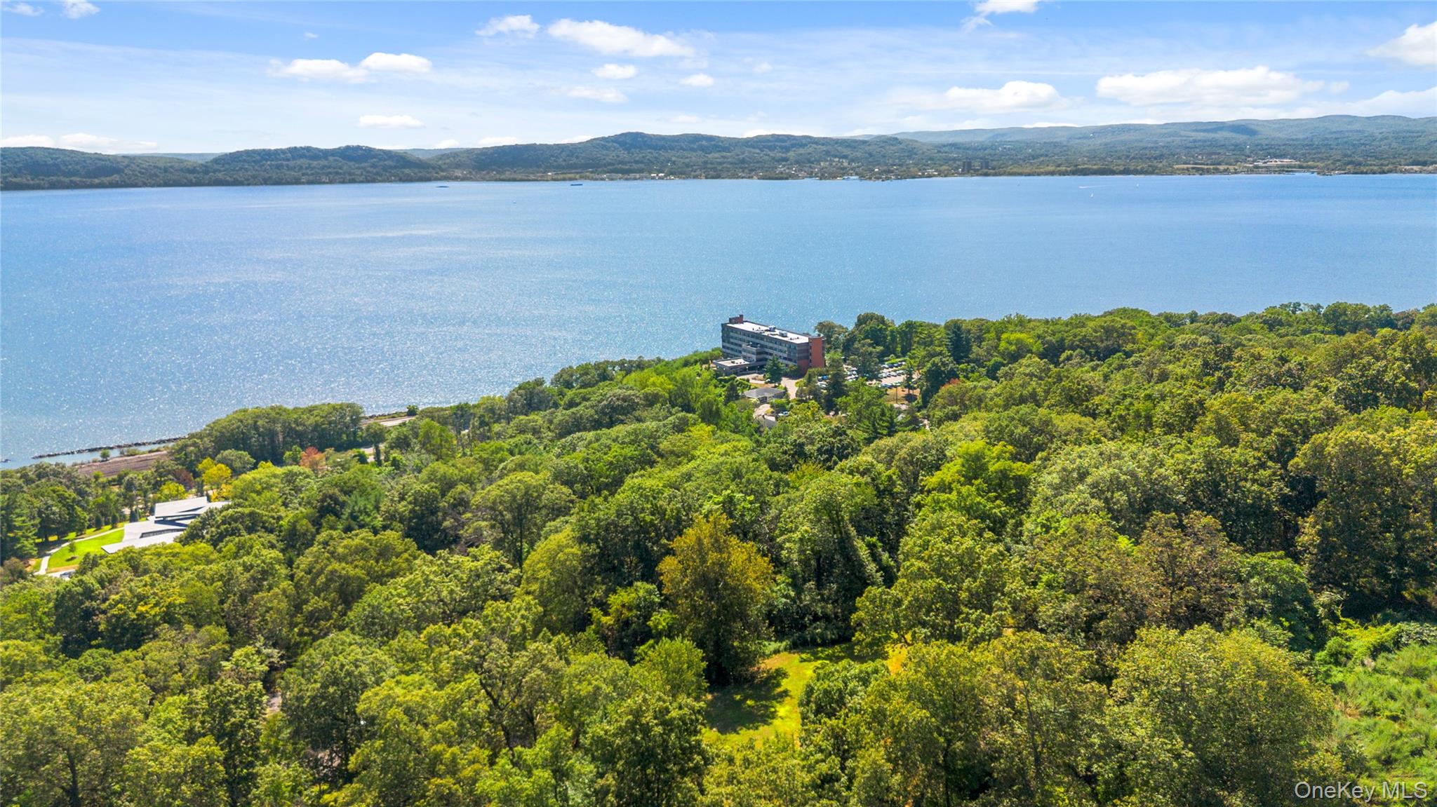 3 Prickly Pear Hill Road Croton-on-Hudson, NY 10520 - Photo 8 of 16 a view of a lake with a lake