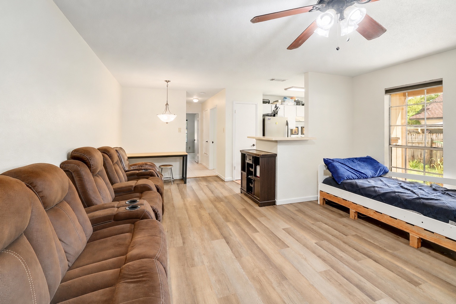 9906 Parliament House Road Austin, TX 78729 - Photo 16 of 33 Hardwood floors and a wide window define this comfortable, open living space.