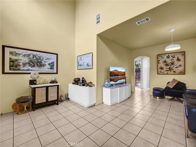 a living room with furniture and kitchen view