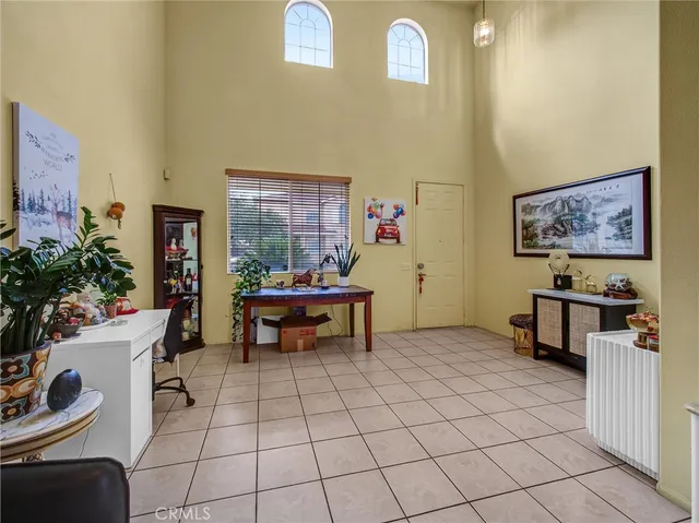 a view of a workspace with furniture and a potted plant