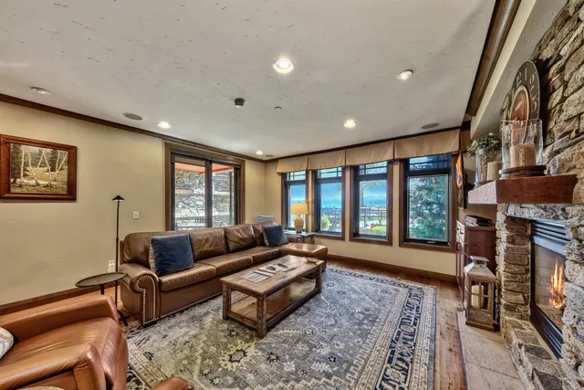 a living room with furniture fireplace and a flat screen tv