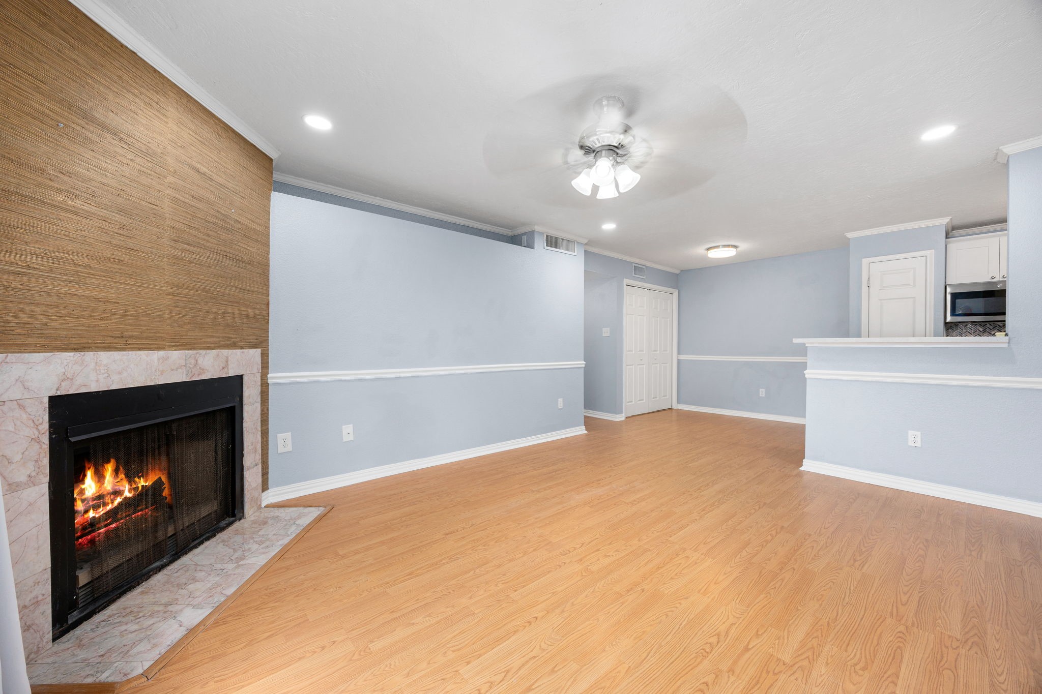 2121 Hepburn Street, Unit 710 Houston, TX 77054 - Photo 18 of 35 a view of an empty room with kitchen and fireplace