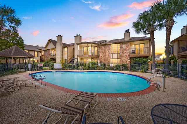 a view of a patio with swimming pool