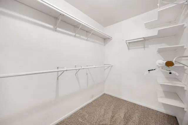 a bathroom with a double vanity sink and mirror with shower