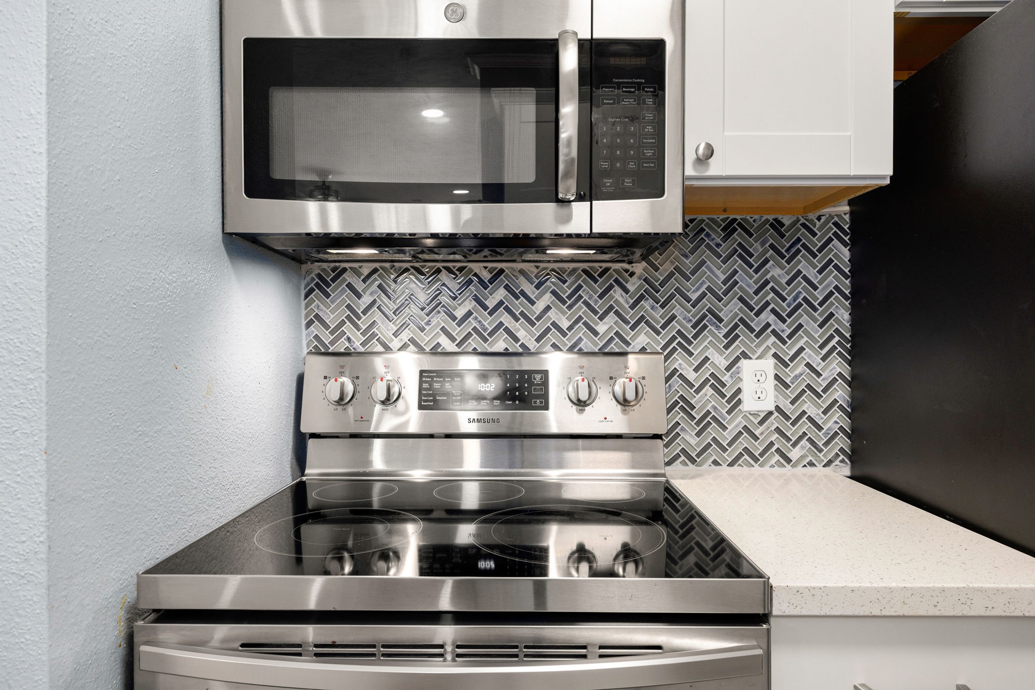 2121 Hepburn Street, Unit 710 Houston, TX 77054 - Photo 9 of 35 a stove top oven sitting inside of a kitchen
