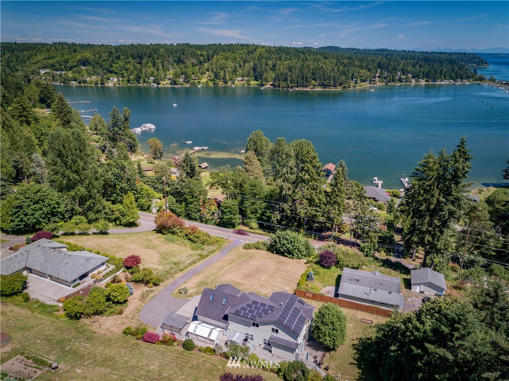 20821 Miller Bay Road Northeast Poulsbo, WA 98370 - Photo 1 of 40 an aerial view of residential houses with outdoor space and lake view