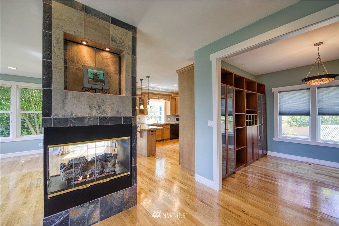 20821 Miller Bay Road Northeast Poulsbo, WA 98370 - Photo 12 of 40 a view of a living room and a fireplace