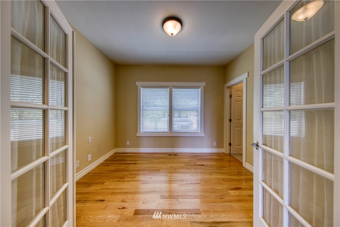 20821 Miller Bay Road Northeast Poulsbo, WA 98370 - Photo 14 of 40 a view of an empty room with a window