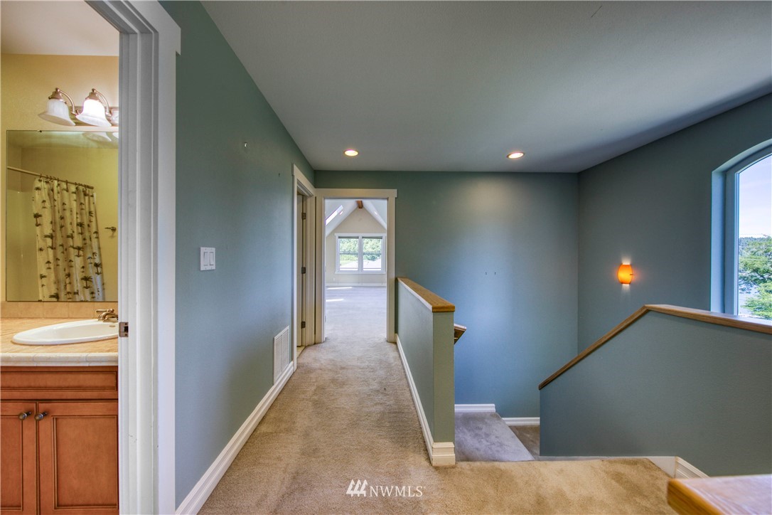 20821 Miller Bay Road Northeast Poulsbo, WA 98370 - Photo 18 of 40 a view of a hallway with windows