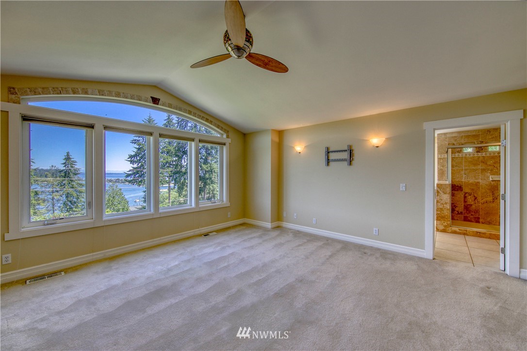 20821 Miller Bay Road Northeast Poulsbo, WA 98370 - Photo 19 of 40 a view of an empty room with a window