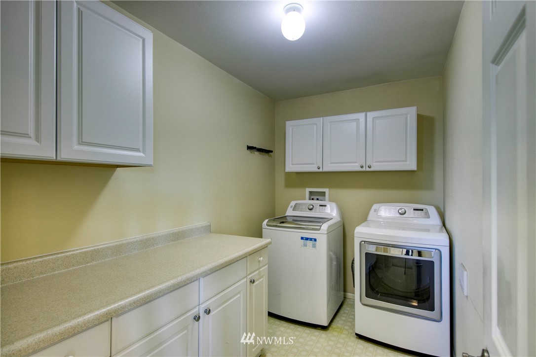 20821 Miller Bay Road Northeast Poulsbo, WA 98370 - Photo 26 of 40 a utility room with dryer and washer