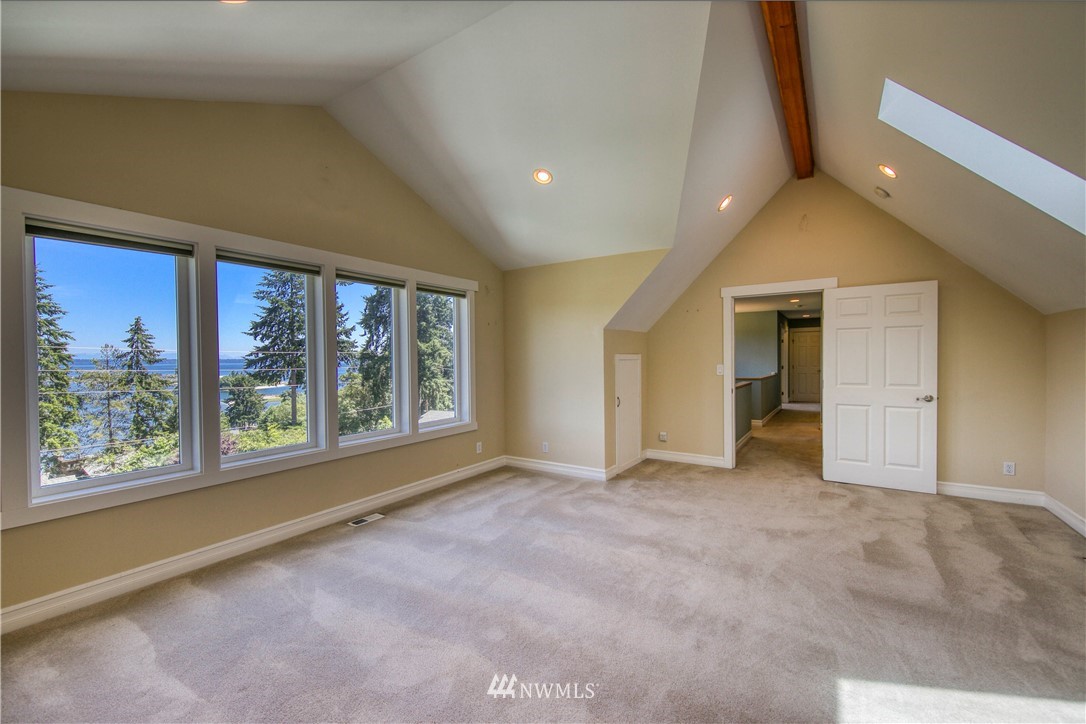 20821 Miller Bay Road Northeast Poulsbo, WA 98370 - Photo 27 of 40 a view of an empty room with a window