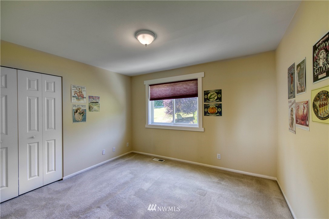 20821 Miller Bay Road Northeast Poulsbo, WA 98370 - Photo 30 of 40 an empty room with windows