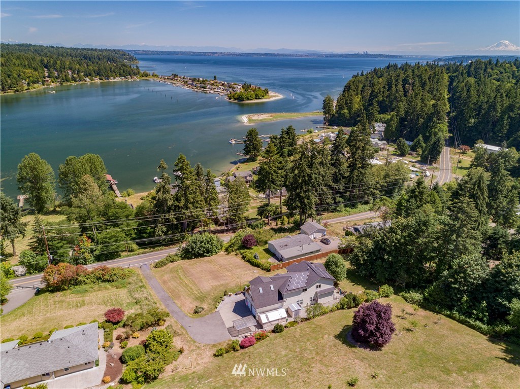 20821 Miller Bay Road Northeast Poulsbo, WA 98370 - Photo 4 of 40 an aerial view of a houses with a lake view
