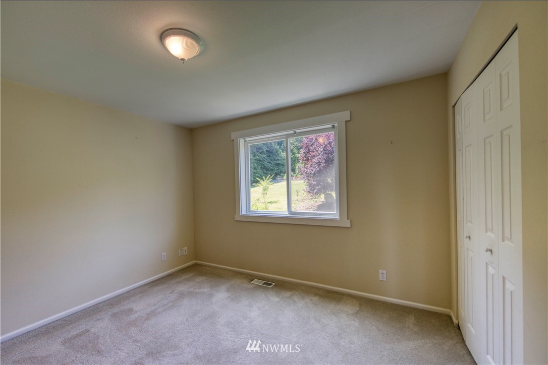 20821 Miller Bay Road Northeast Poulsbo, WA 98370 - Photo 32 of 40 an empty room with a window