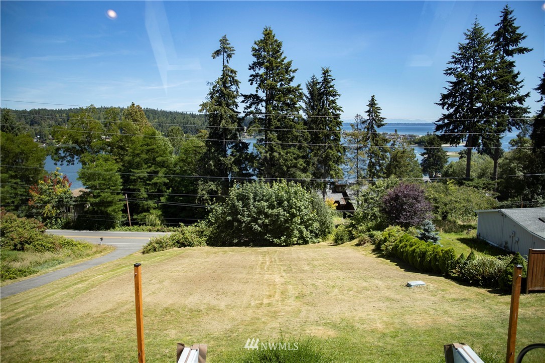 20821 Miller Bay Road Northeast Poulsbo, WA 98370 - Photo 34 of 40 a view of a backyard of the house