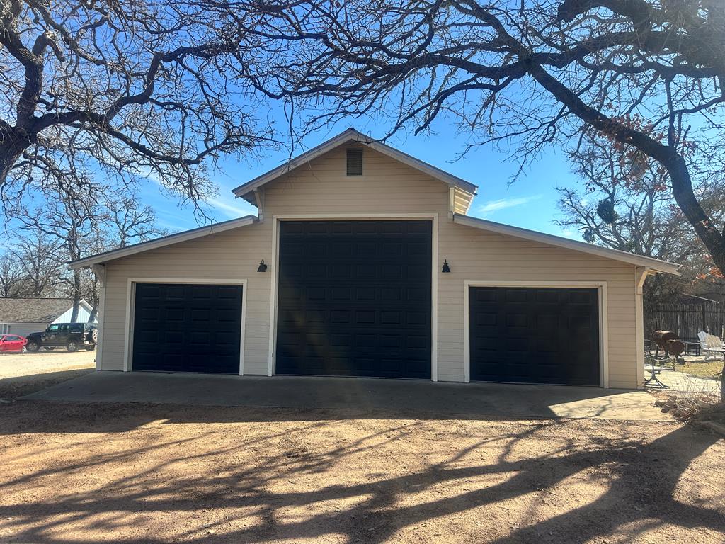 44 Segner Road Fredericksburg, TX 78624 - Photo 21 of 21 a view of a house with a yard and garage
