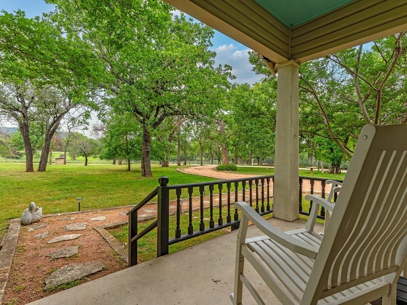 44 Segner Road Fredericksburg, TX 78624 - Photo 3 of 21 a view of a two chairs in the deck next to a yard