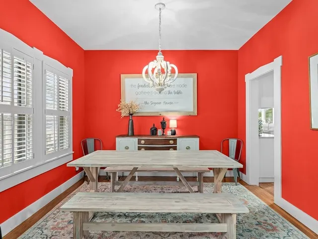 a view of a dining room with furniture window and wooden floor