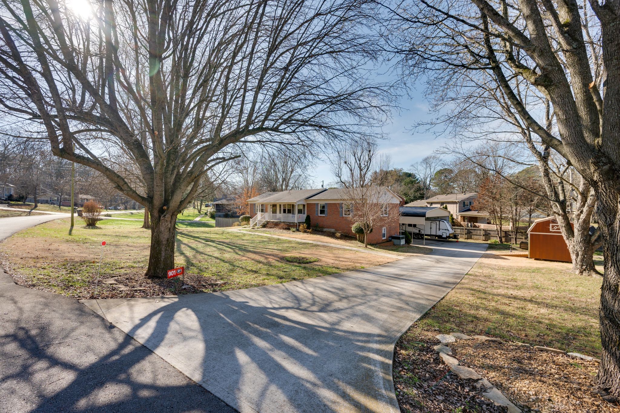 901 Azalea Drive Columbia, TN 38401 - Photo 1 of 28 a street view with large trees