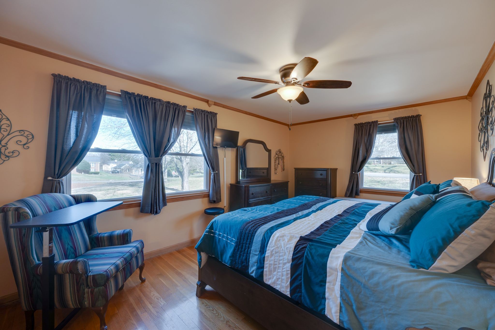 901 Azalea Drive Columbia, TN 38401 - Photo 15 of 28 a spacious bedroom with a bed and a chandelier