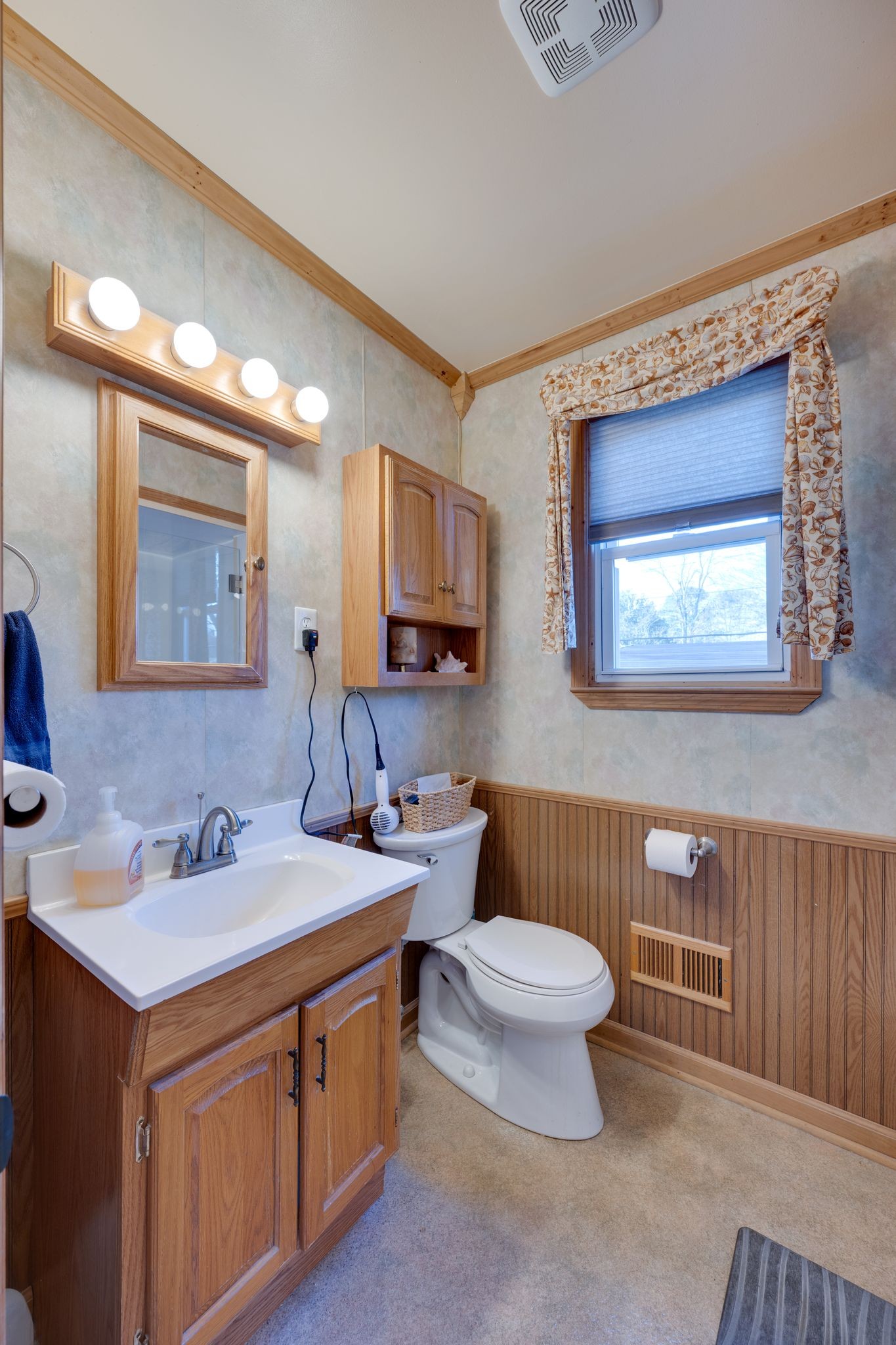 901 Azalea Drive Columbia, TN 38401 - Photo 17 of 28 a bathroom with a double vanity sink toilet and a mirror