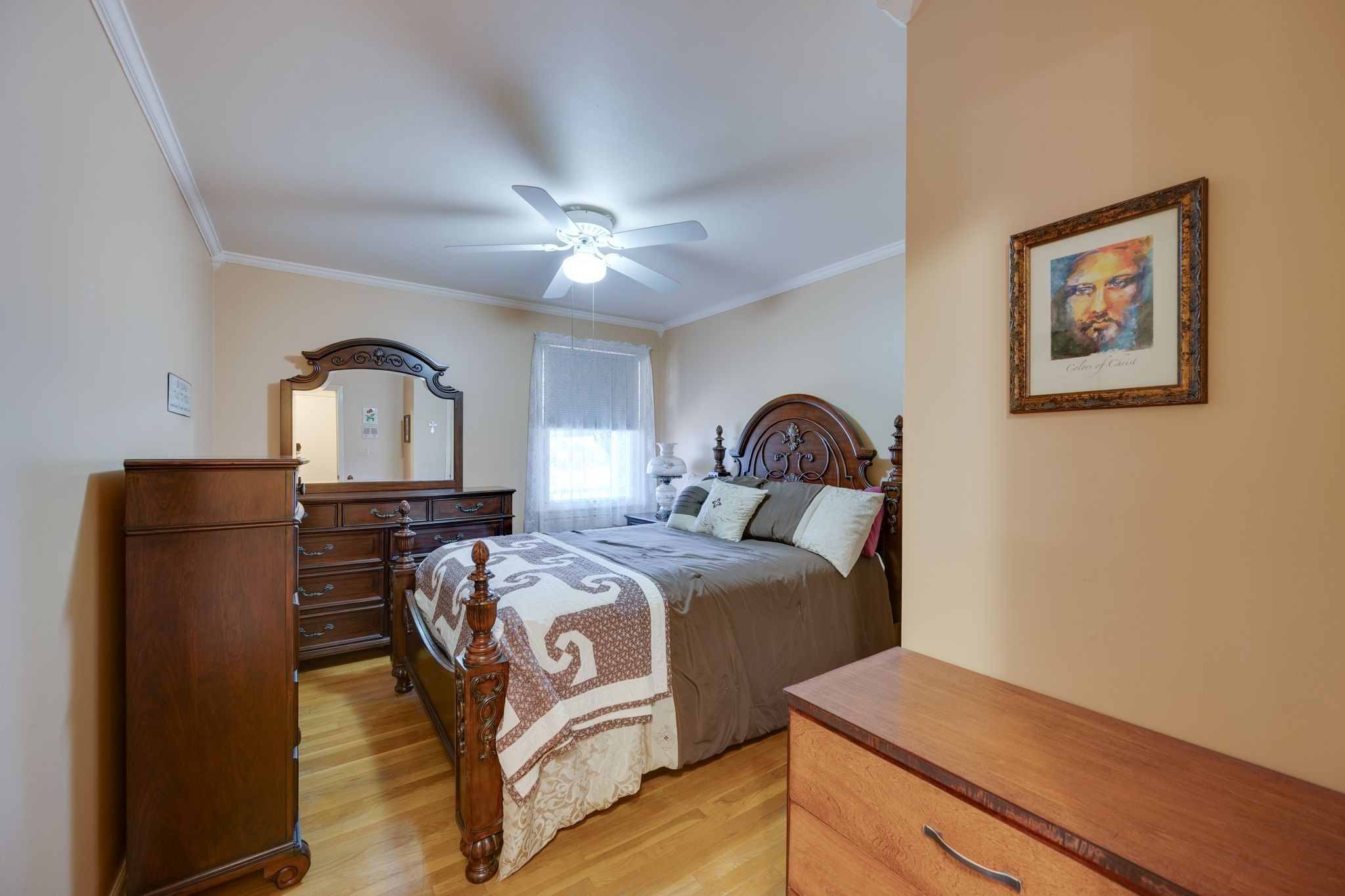 901 Azalea Drive Columbia, TN 38401 - Photo 18 of 28 a bedroom with a bed and a chandelier