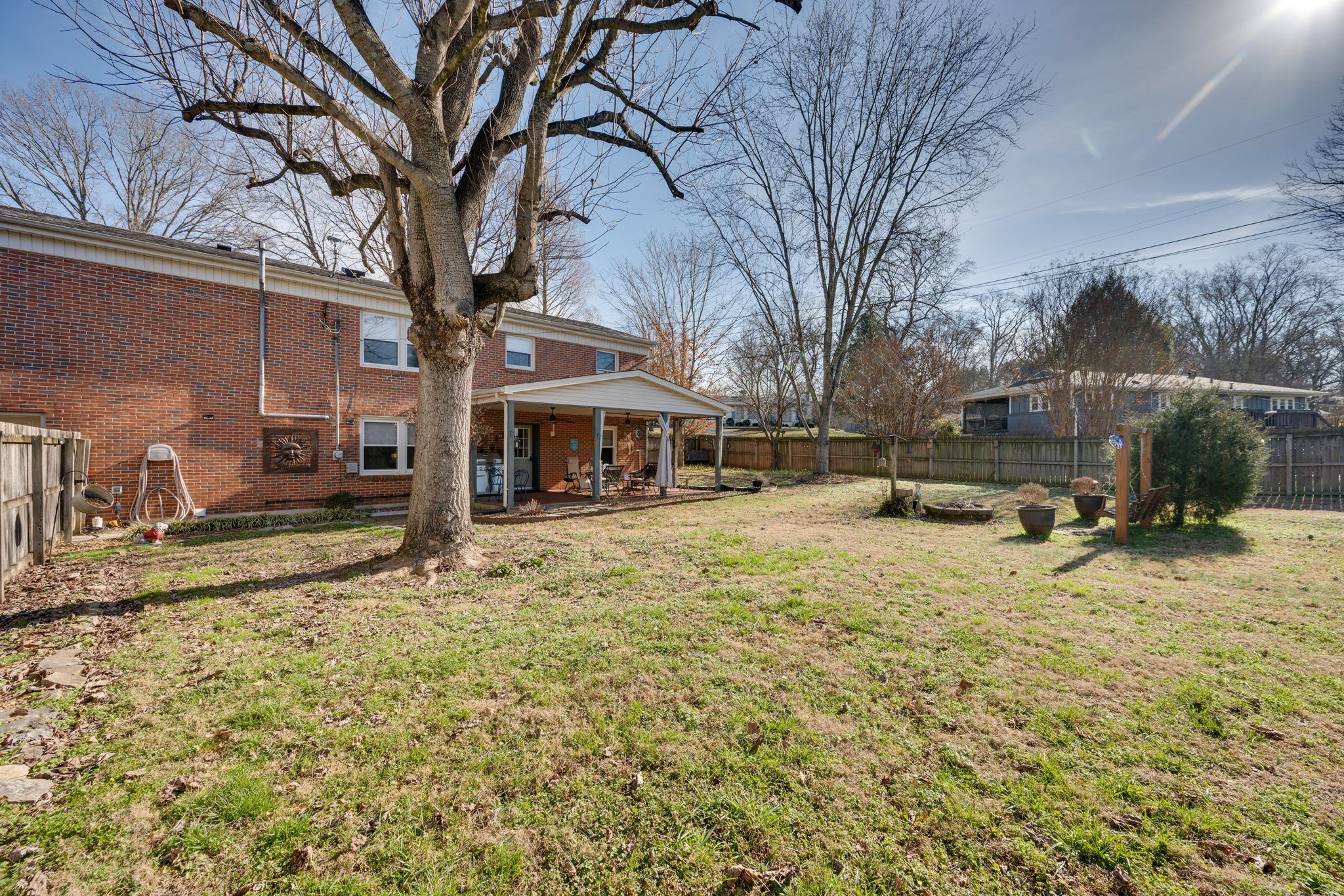 901 Azalea Drive Columbia, TN 38401 - Photo 27 of 28 a backyard of a house with fire pit and trees