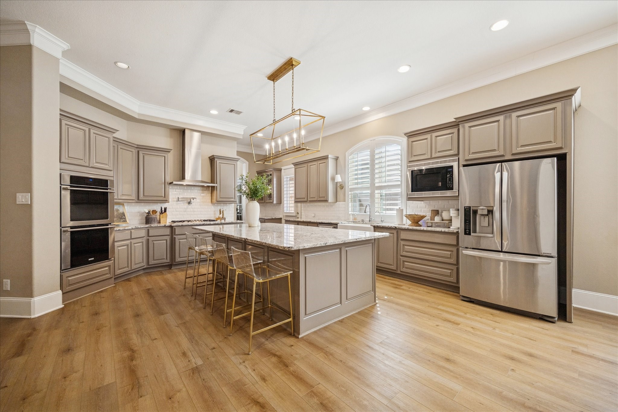 2914 Rutherford Pl Court Katy, TX 77494 - Photo 12 of 36 Spacious kitchen offering abundant counter space, stainless steel appliances, and seamless flow into the dining and living areas.