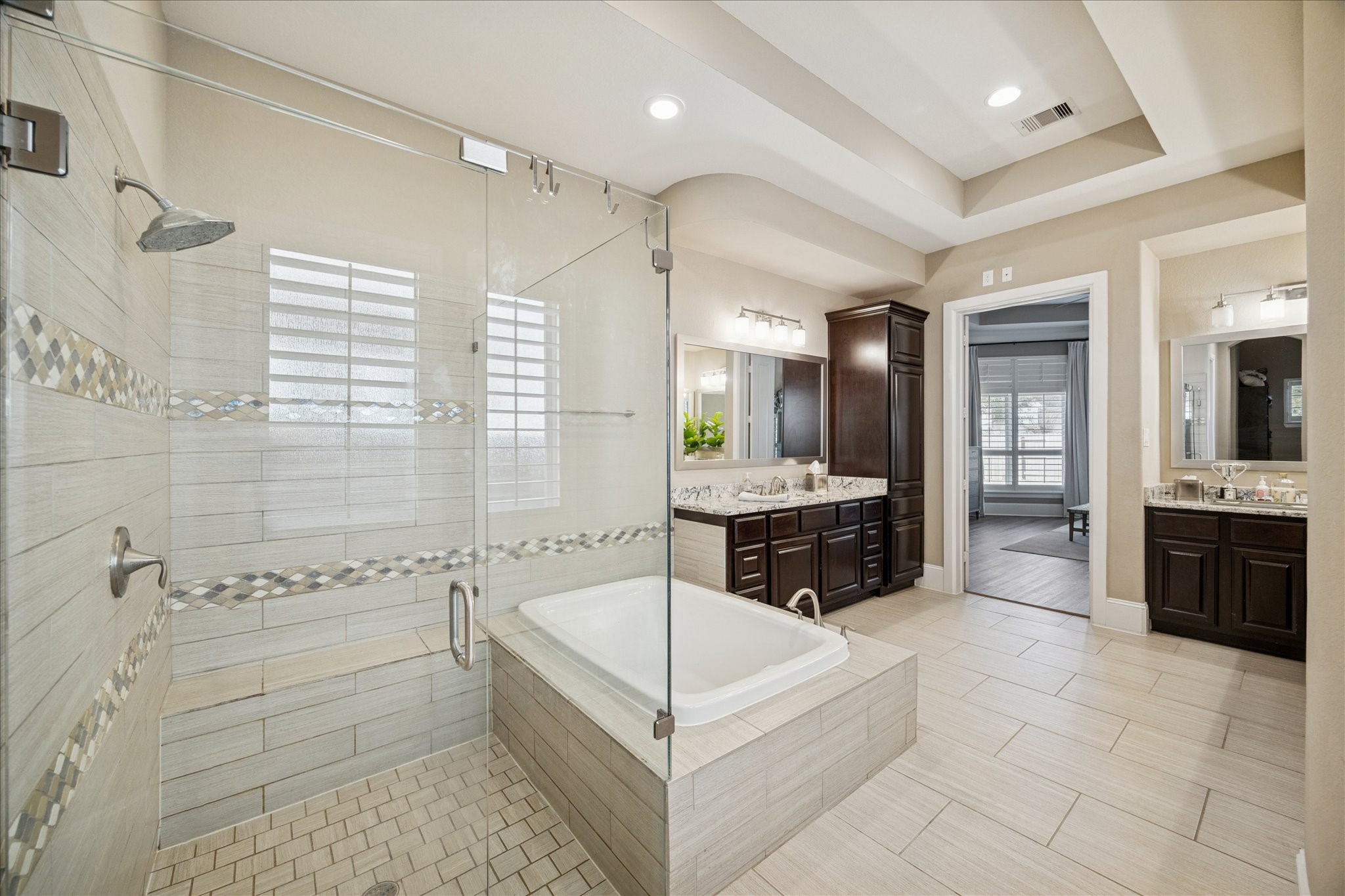 2914 Rutherford Pl Court Katy, TX 77494 - Photo 15 of 36 Spa-inspired primary bath with oversized walk-in shower, soaking tub, tile surround, and elegant finishes.