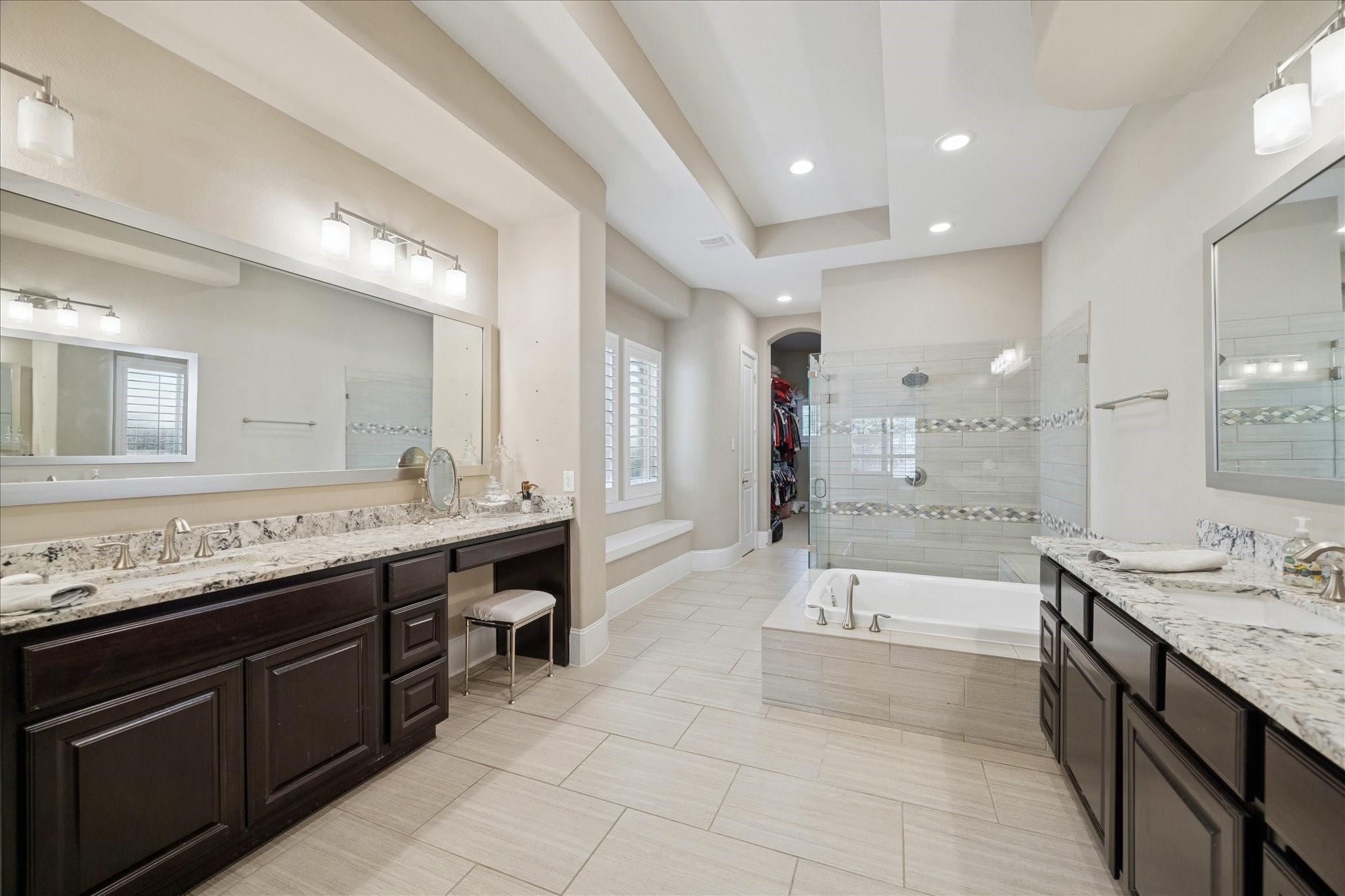 2914 Rutherford Pl Court Katy, TX 77494 - Photo 16 of 36 Well-appointed primary bath offering abundant space, natural light, and a seamless flow between vanities, tub, and shower.