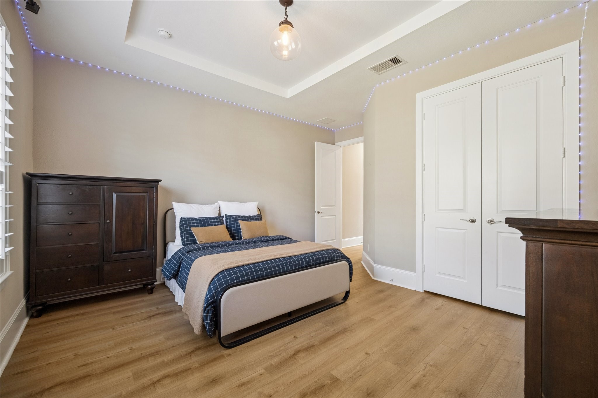 2914 Rutherford Pl Court Katy, TX 77494 - Photo 17 of 36 Downstairs secondary bedroom showcasing clean lines, neutral finishes, and functional layout. Perfect for guests or multigenerational living.