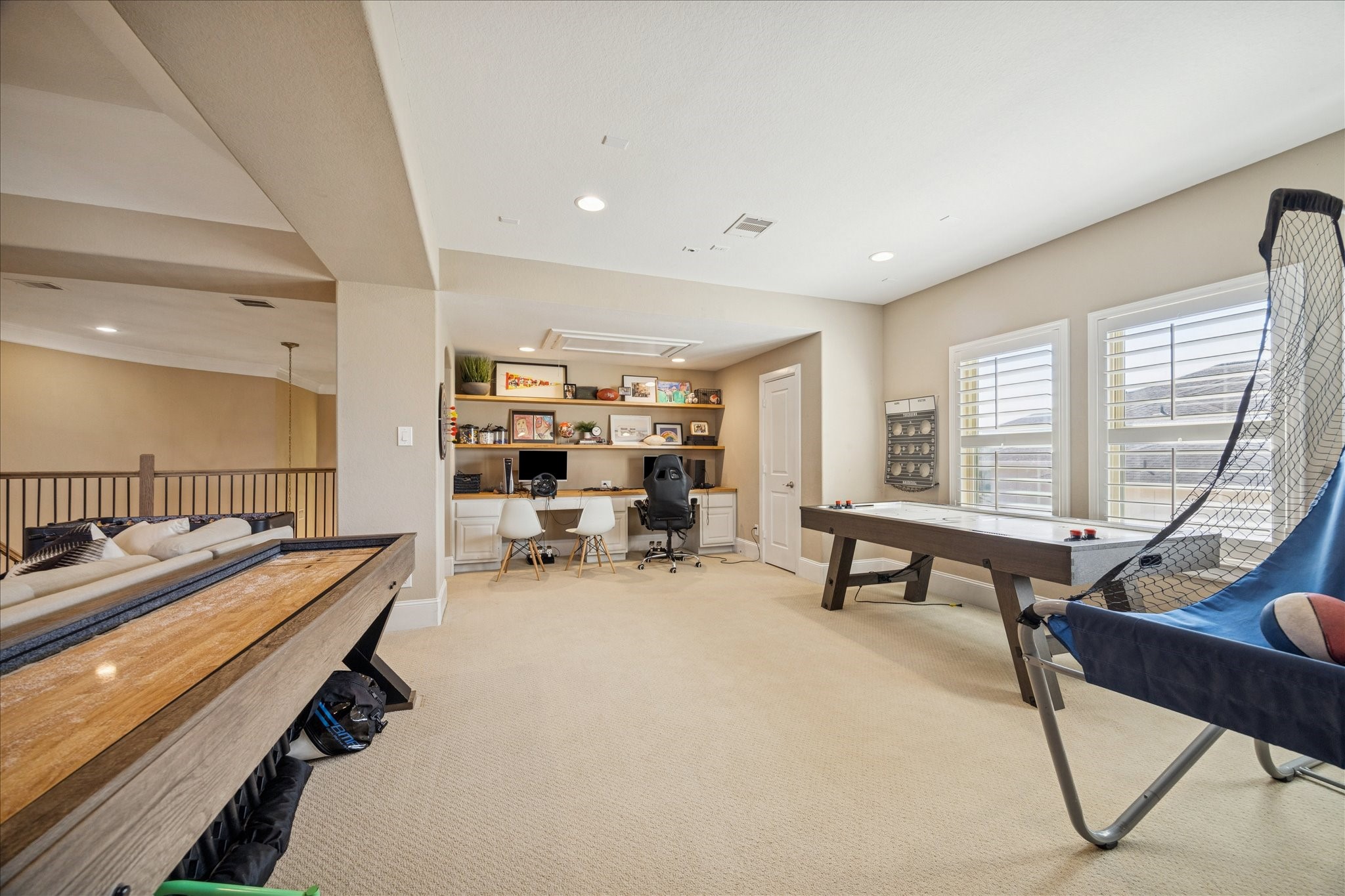 2914 Rutherford Pl Court Katy, TX 77494 - Photo 20 of 36 Spacious game room with built-in desk area and room for recreation, media, or additional workspace—ideal for all ages.