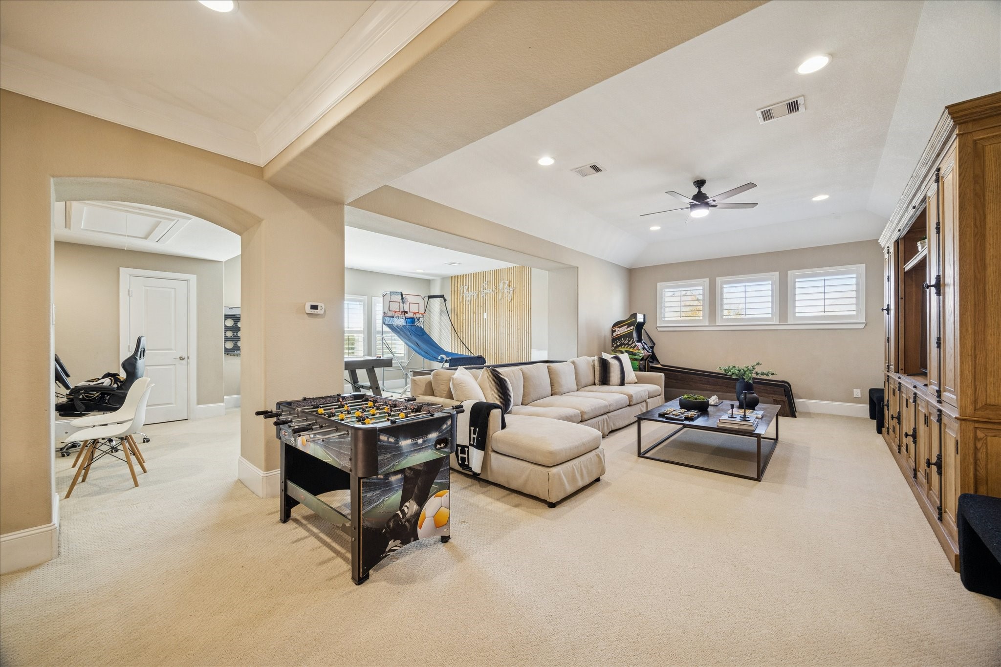 2914 Rutherford Pl Court Katy, TX 77494 - Photo 22 of 36 Versatile game room with room for recreation, lounging, and entertaining, offering abundant natural light and neutral finishes.