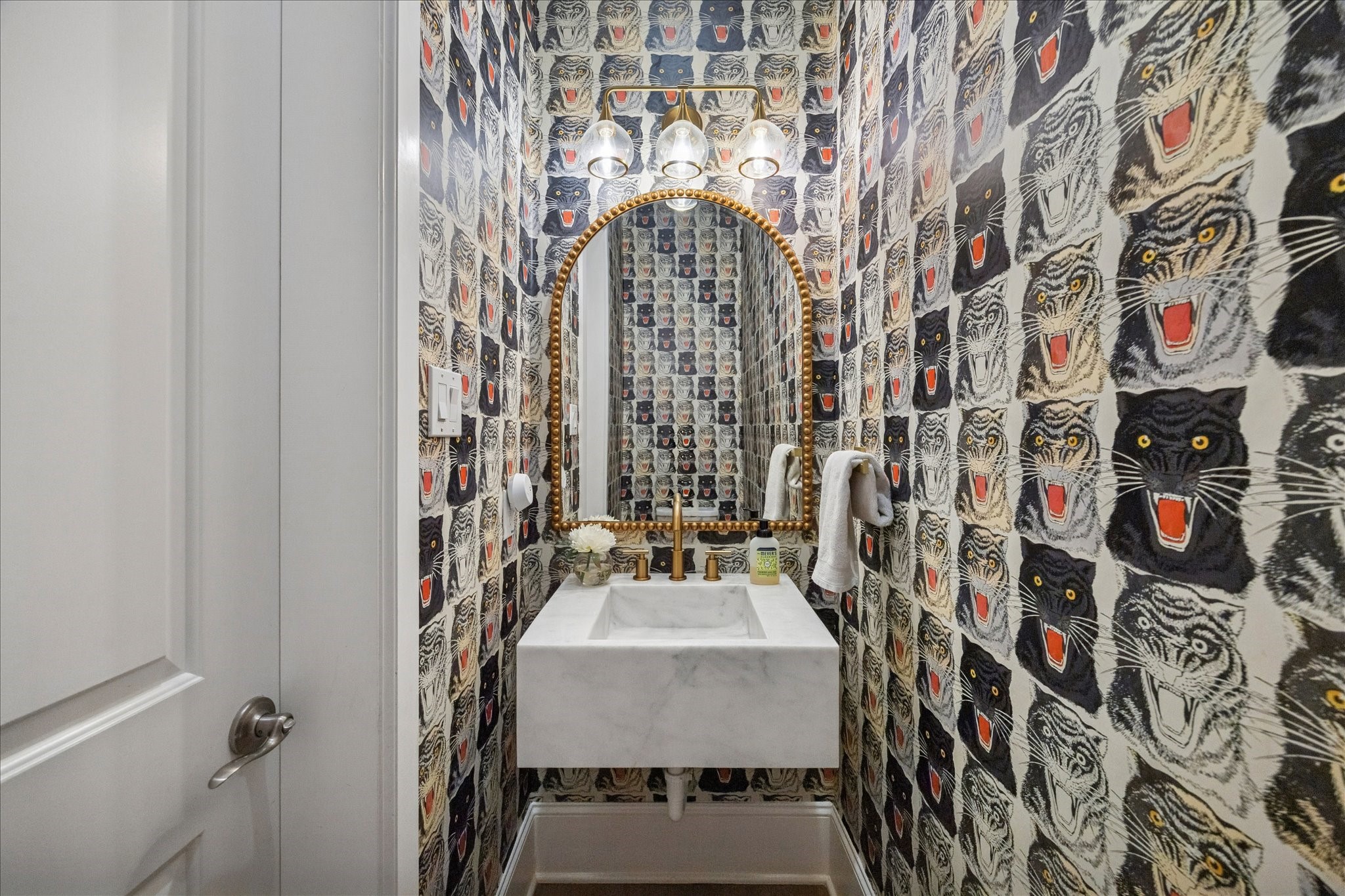 2914 Rutherford Pl Court Katy, TX 77494 - Photo 27 of 36 Stylish powder bath with statement wallpaper, custom vanity, and designer mirror for a distinctive touch.