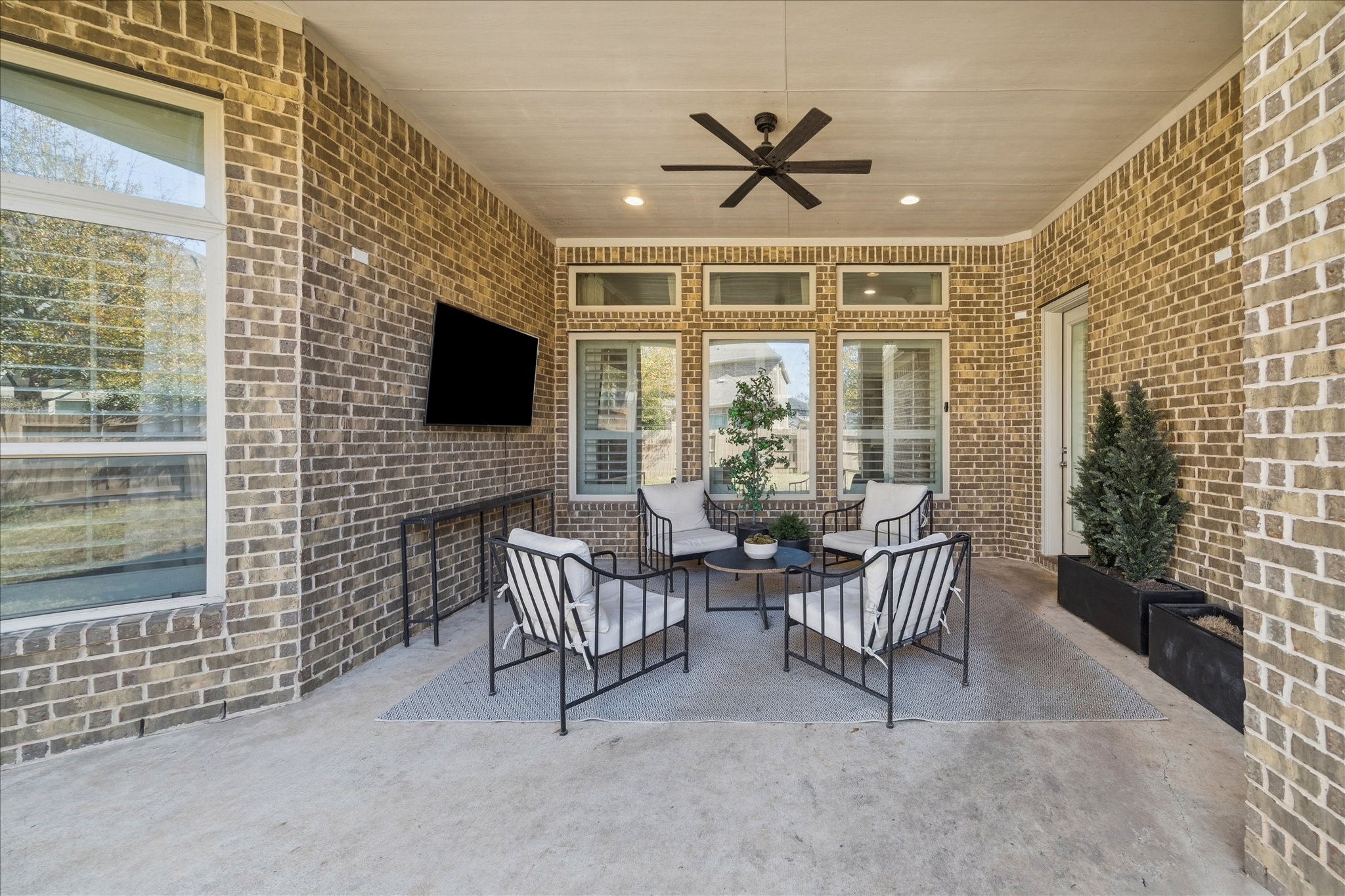 2914 Rutherford Pl Court Katy, TX 77494 - Photo 28 of 36 Covered outdoor living area with ceiling fan and recessed lighting, perfect for relaxing or entertaining year-round.