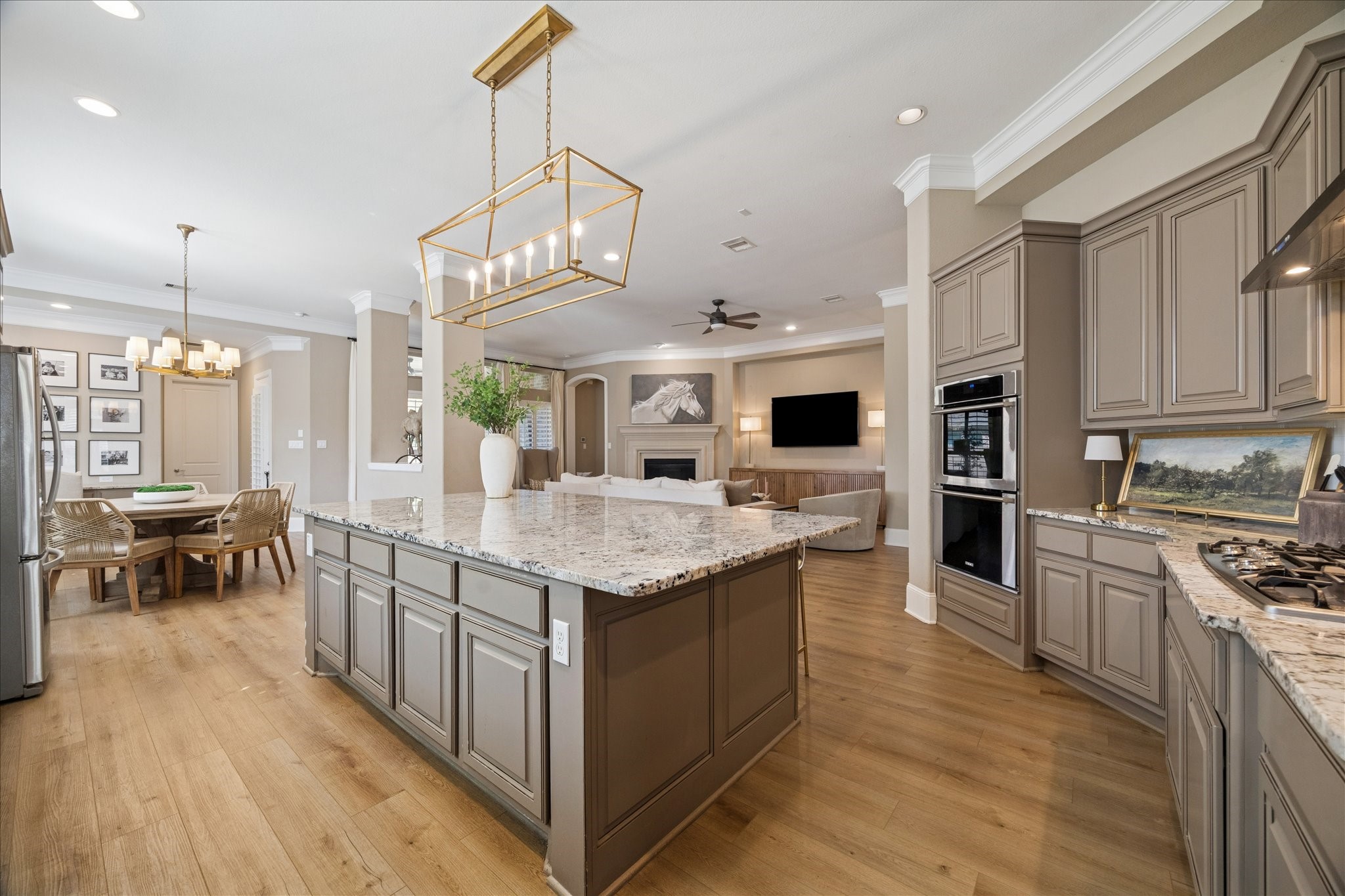 2914 Rutherford Pl Court Katy, TX 77494 - Photo 3 of 36 Open-concept layout showcasing the kitchen’s connection to the main living space, ideal for gatherings and modern living.