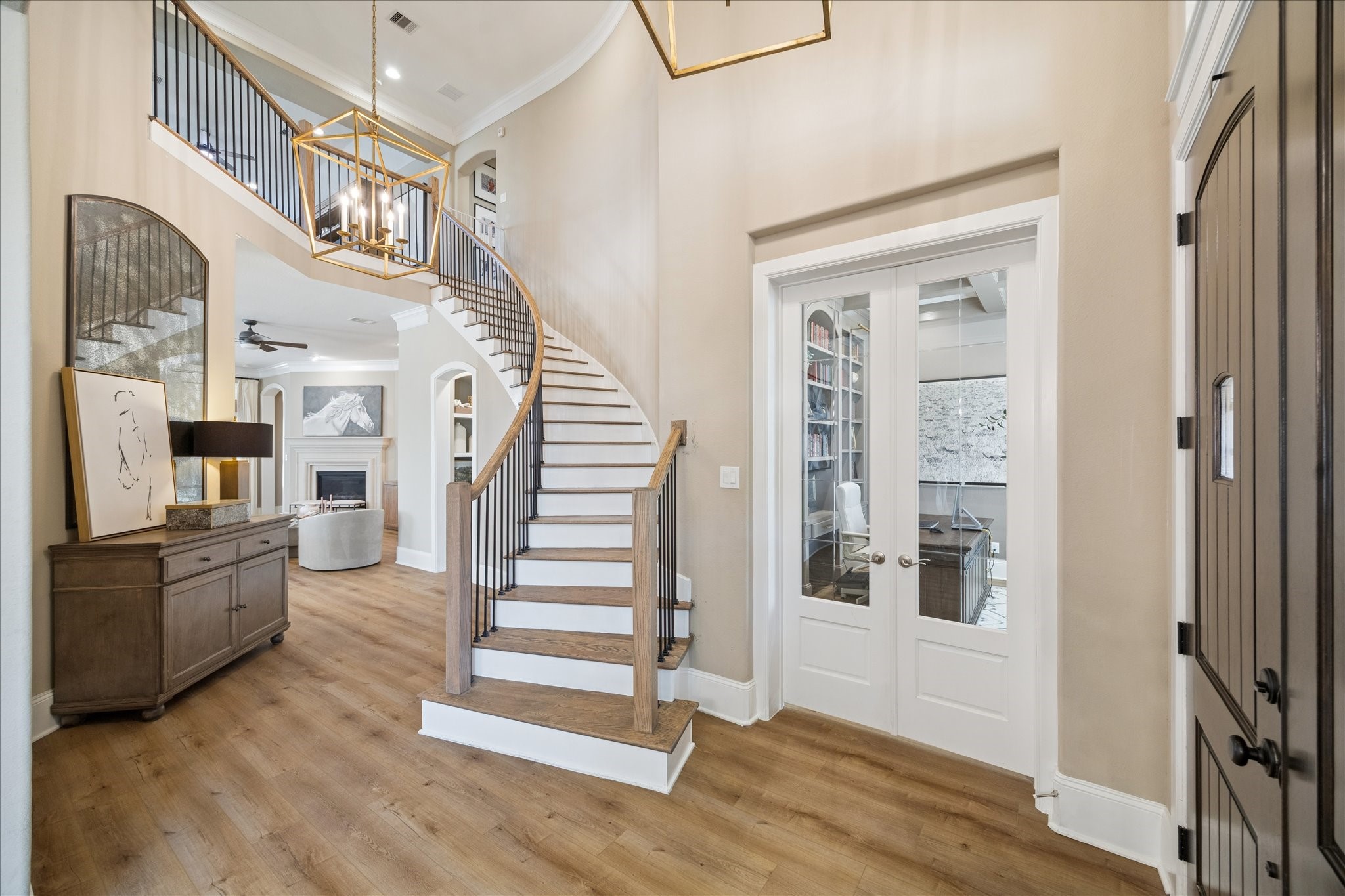 2914 Rutherford Pl Court Katy, TX 77494 - Photo 6 of 36 Grand foyer with sweeping curved staircase, high ceilings, and warm updated flooring creating a dramatic first impression.